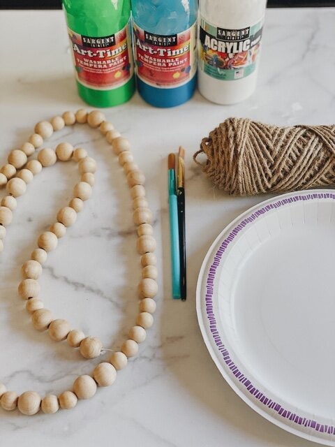 DIY Spring Wood Bead Garland With Tassels featured by top AL home decor blogger, She Gave It A Go