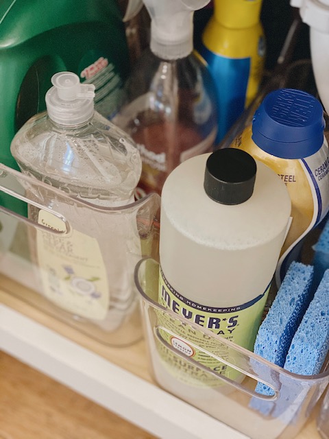 5 Easy and Super Practical Under Sink Organization Ideas for your Home featured by top AL home and lifestyle blogger, She Gave It A Go |Under Sink Organization by popular Alabama lifestyle blog, She Gave It A Go: image of cleaning supply and sponges in an acrylic bin. 