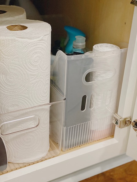 5 Easy and Super Practical Under Sink Organization Ideas for your Home featured by top AL home and lifestyle blogger, She Gave It A Go |Under Sink Organization by popular Alabama lifestyle blog, She Gave It A Go: image of paper towels in a acrylic bin. 