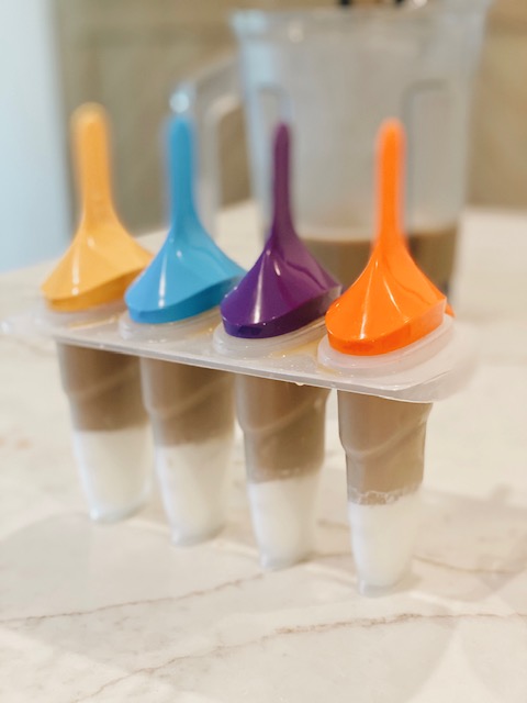Iced Coffee Popsicles Recipe, the perfect summer dessert featured by top AL lifestyle blogger, She Gave It A Go |Iced Coffee Popsicles by popular Alabama lifestyle blog: image of ice coffee popsicles. 