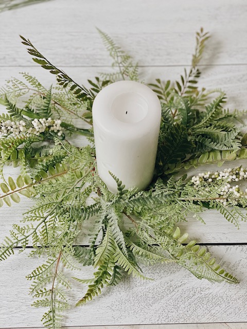 Cool DIY Summer Candle Rings, a Tutorial featured by top AL home blogger, She Gave It A Go | Candle Rings by popular Alabama DIY blog, She Gave It A Go: image of a pillar candle in the center of a faux greenery candle ring. 