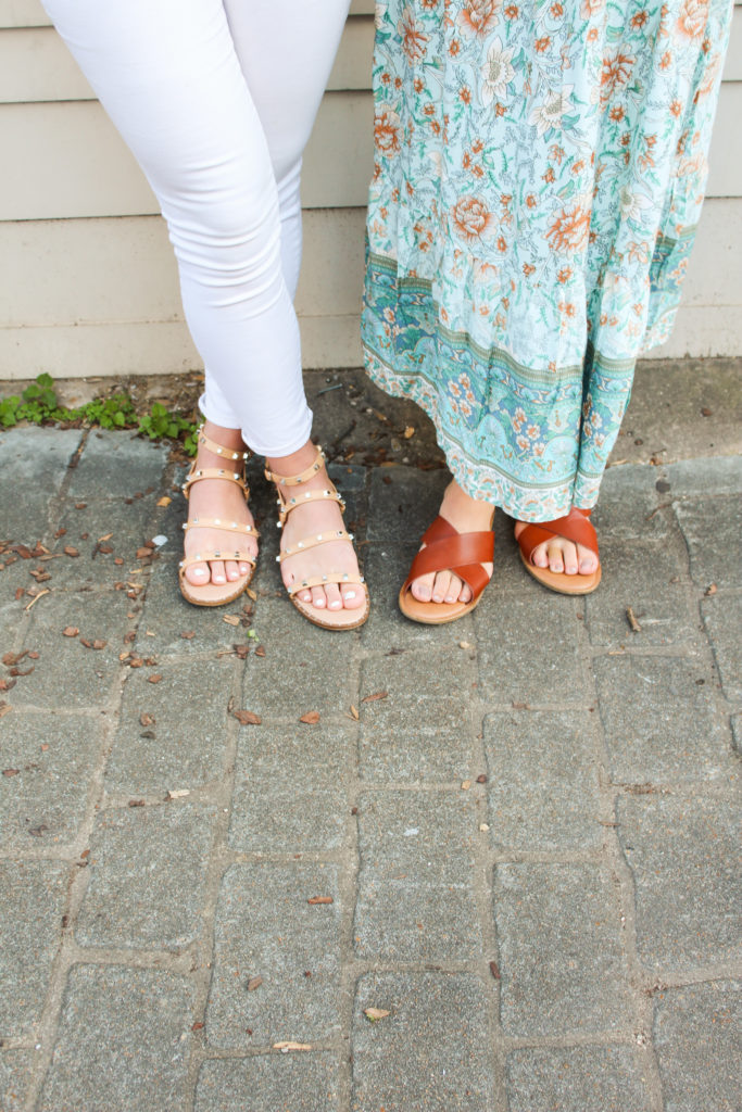  Christian Playlist for your Summer Road Trip featured by top AL lifestyle blogger, She Gave It A Go | Christian Playlist by popular Alabama lifestyle blog, She Gave It A Go: image of a woman wearing a pair of white jeans and tan silver studded strap sandals standing next to another woman wearing a blue floral print maxi dress with brown cross strap sandals.