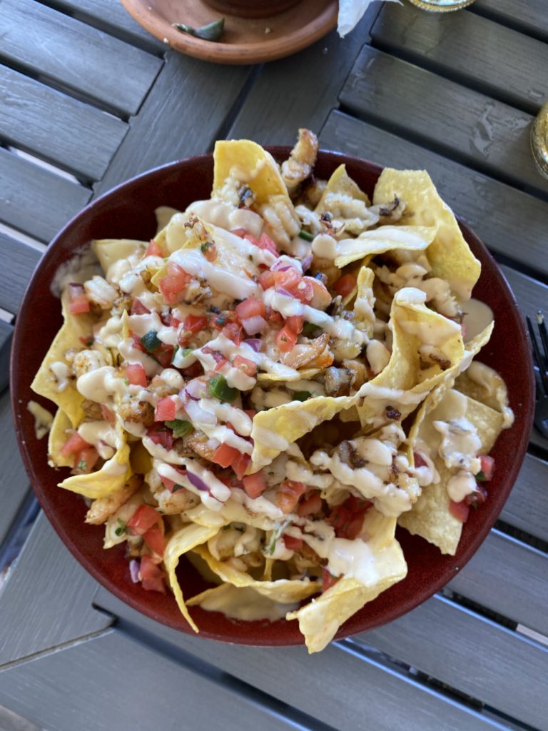 The Best Things to Do in Key Largo for Couples, a travel guide featured by top US travel blogger, She Gave It A Go. Things to do in Key Largo by popular Alabama travel blog, She Gave It A Go: image of a plate of nachos. 