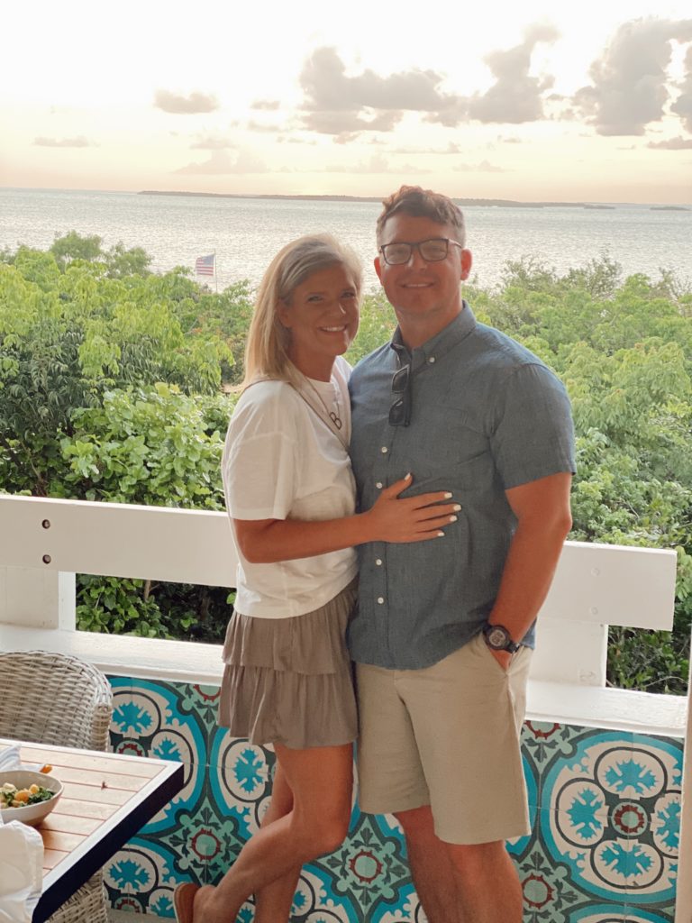 The Best Things to Do in Key Largo for Couples, a travel guide featured by top US travel blogger, She Gave It A Go | Things to do in Key Largo by popular Alabama travel blog, She Gave It A Go: image of a couple standing together with the ocean in the background. 
