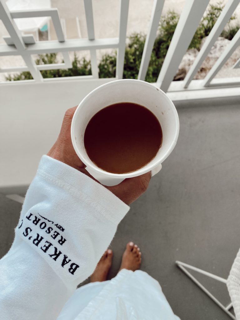 The Best Things to Do in Key Largo for Couples, a travel guide featured by top US travel blogger, She Gave It A Go | Things to do in Key Largo by popular Alabama travel blog, She Gave It A Go: image of a woman holding a cup of coffee. 