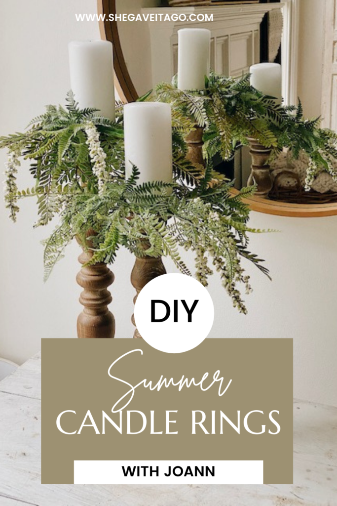 Candle Rings by popular Alabama DIY blog, She Gave It A Go: Pinterest image of two while pillar candles on wooden candle pillars decorated with faux green candle rings. 
