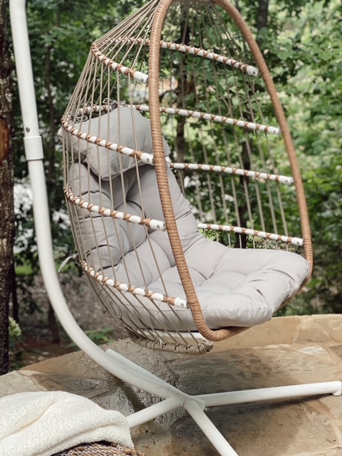 Family Patio Ideas for summer featured by top AL home blogger, She Gave It A Go |  Family Patio Ideas by popular Alabama life and style blog, She Gave It A Go: image of a hanging rattan chair with a grey tuft cushion. 