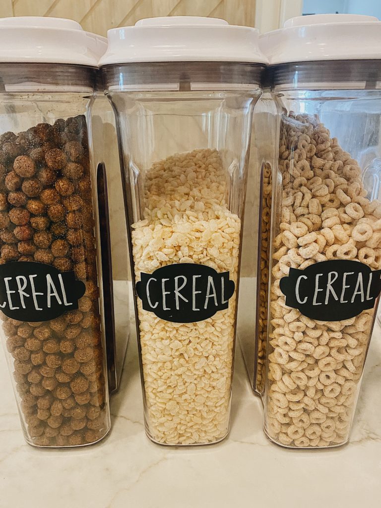 21 Summer Pantry Staples your Family Needs featured by top AL lifestyle blogger, She Gave It A Go | Pantry Items by popular Alabama lifestyle blog, She Gave It A Go: image of cereal in acrylic cereal containers with black labels. 