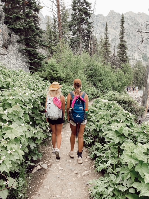 7 Best Things to Do in Jackson Hole with Teens featured by top AL family blogger, She Gave It A Go. |Best Things to do in Jackson Hole by popular Alabama travel blog, She Gave it a Go: image of a family hiking in Jackson Hole. 