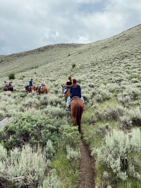 7 Best Things to Do in Jackson Hole with Teens featured by top AL family blogger, She Gave It A Go | Best Things to do in Jackson Hole by popular Alabama travel blog, She Gave it a Go: image of a family horseback riding. 