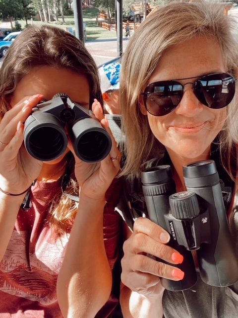7 Best Things to Do in Jackson Hole with Teens featured by top AL family blogger, She Gave It A Go | Best Things to do in Jackson Hole by popular Alabama travel blog, She Gave it a Go: image of two women holding binoculars. 