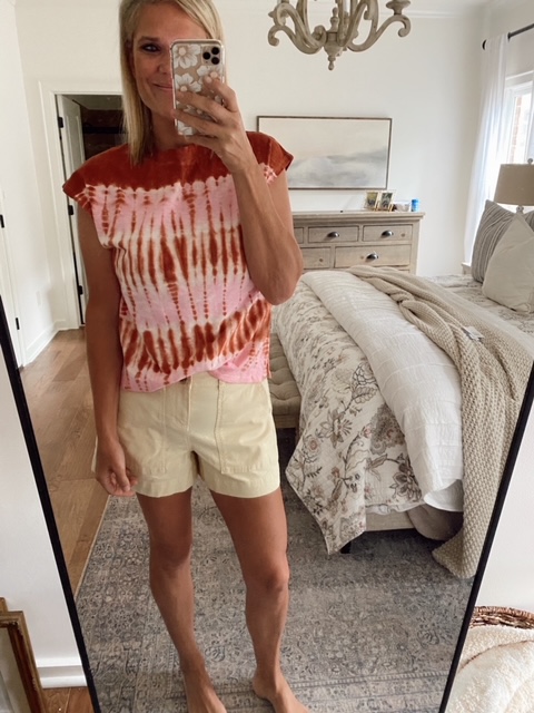 Welcome Home Saturday by popular Alabama lifestyle blog, She Gave It A Go: image of a woman wearing a pink and orange tie dye shirt with a tan pair of shorts.