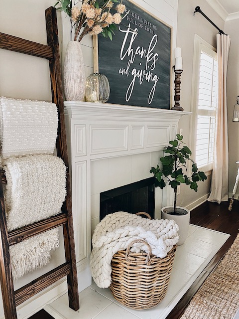 mantel with blanet ladder and a chalkboard wood sign for Thanksgiving 