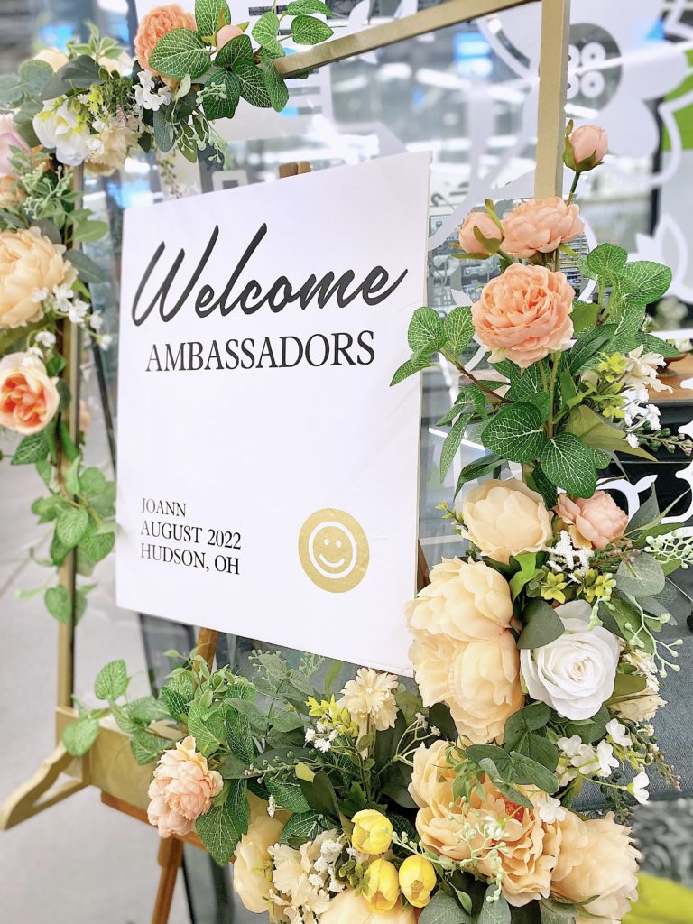 beautiful welcome sign with faux florals
