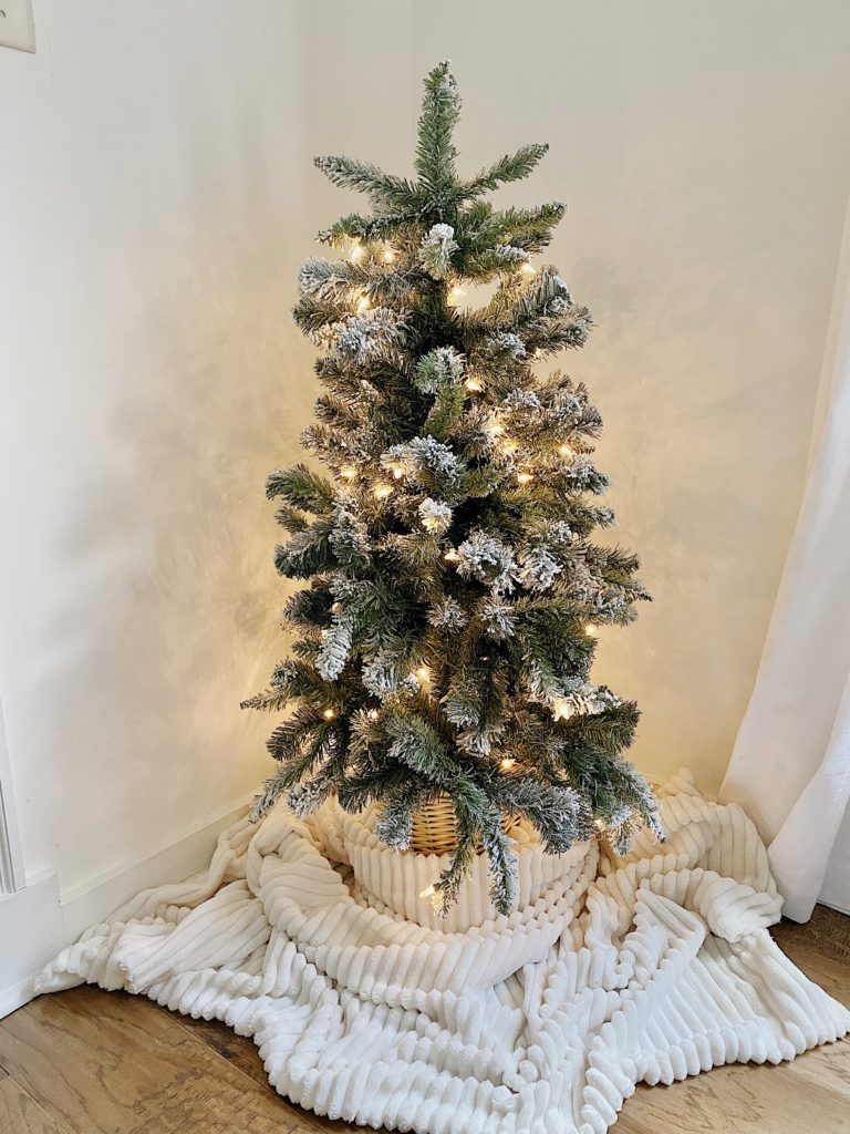 christmas tree in corner of living room 