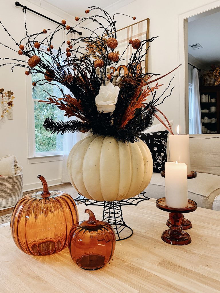 Halloween pumpkin vase styled on coffee table