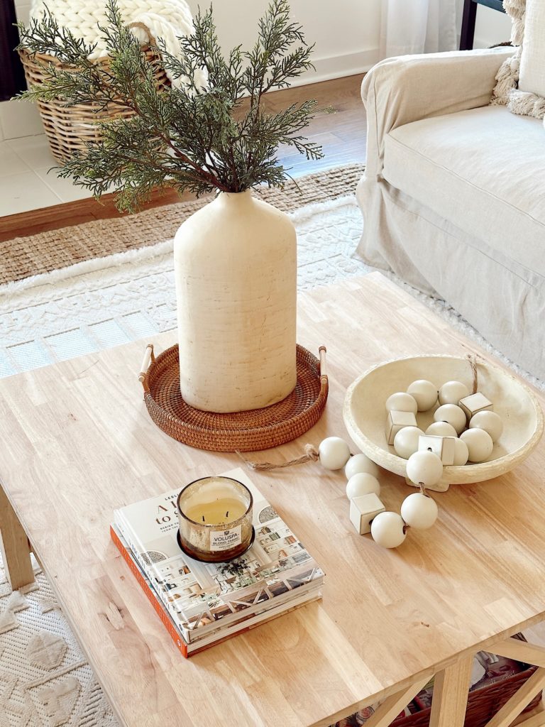 coffee table with decor elements styled on it