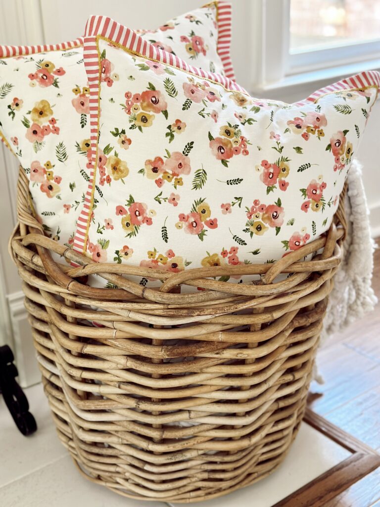 colorful printed, floral pillows in basket