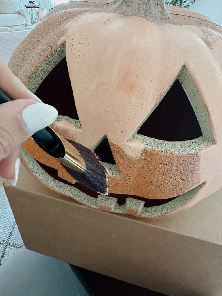 painting the DIY terracotta pumpkin