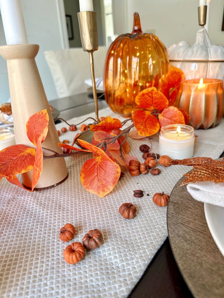 dried pomegrantes and faux garland for cozy thanksgiving dining