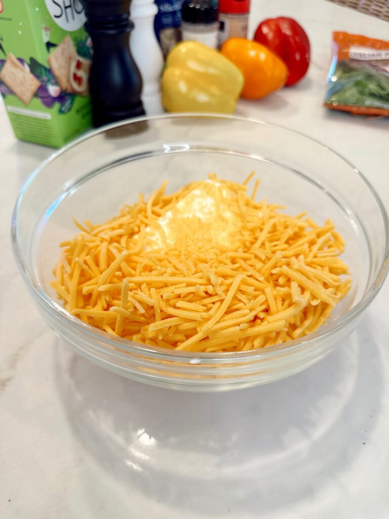 cream cheese and chedder cheese in a glass ball