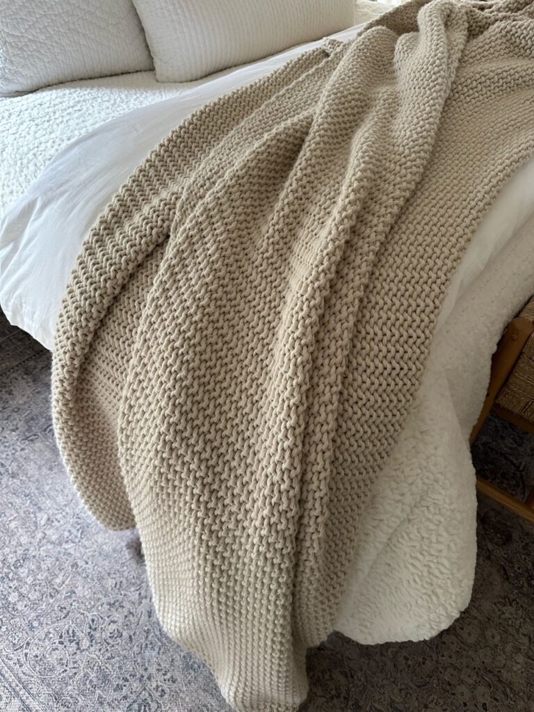 chunky knit blanket draped for cozy winter decor ideas