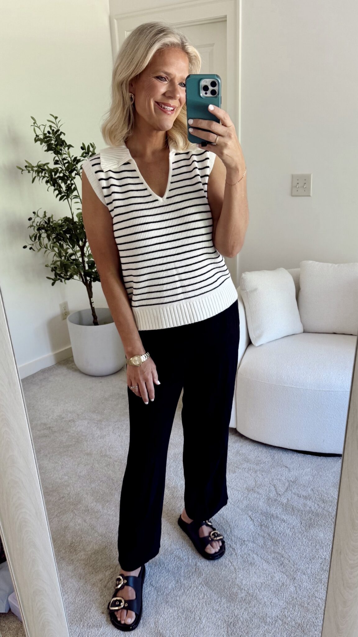 A stylish, age-appropriate outfit featuring a striped top and relaxed linen pants, offering a perfect balance of trendy and comfortable for everyday wear.
